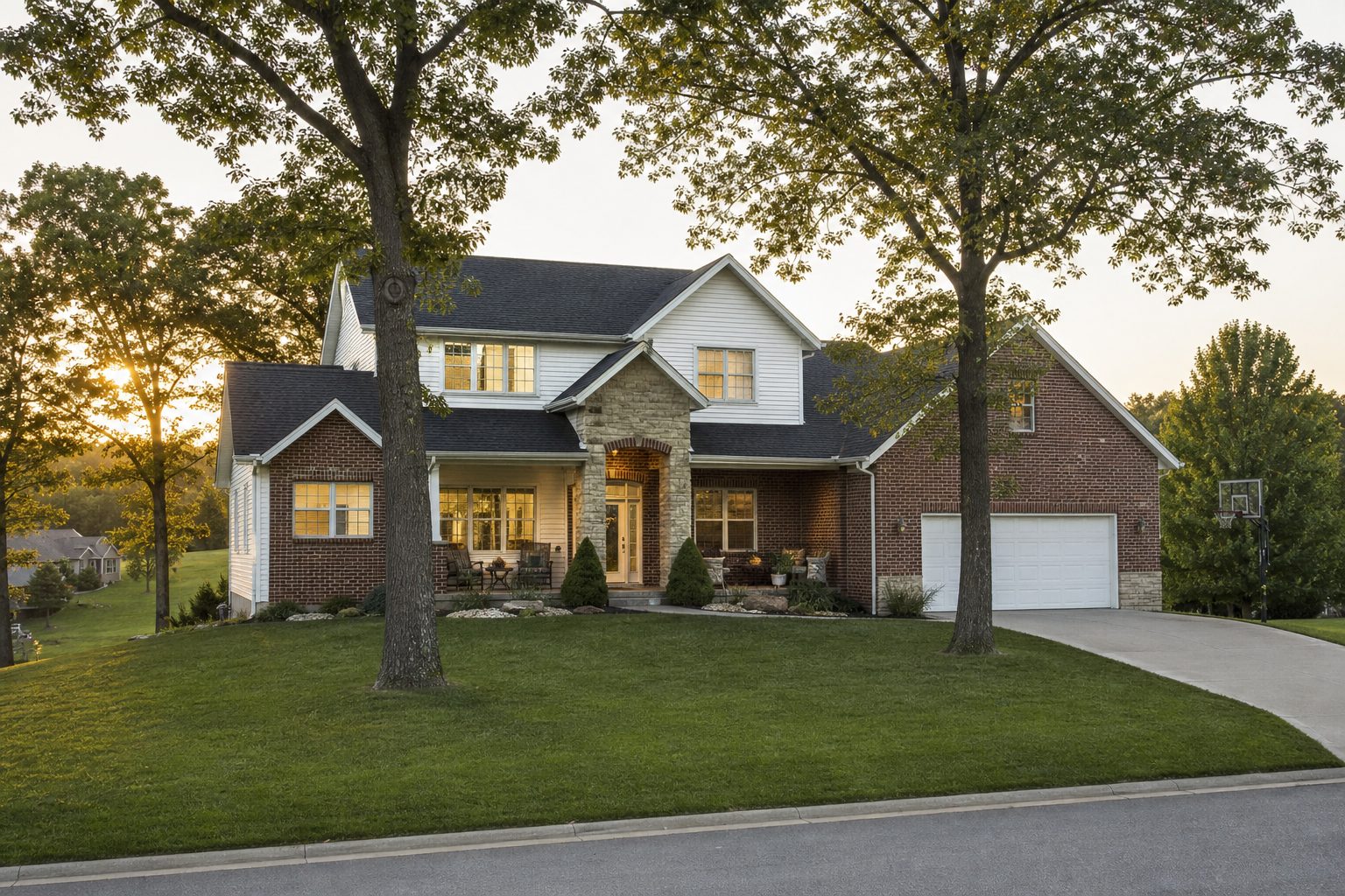 A brick and siding family home in Springfield, Missouri at golden hour